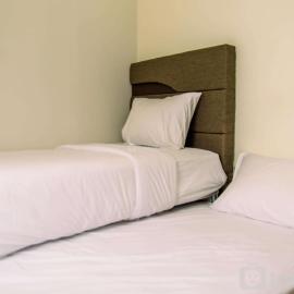 Homey and Serene 2BR at Great Western Resort Apartment By Travelio โรงแรมในPumpangsineng