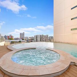 High-Rise Modern Oasis with Pool and City Views
