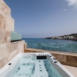 DuplexPenthouse seafront with hot tub by Homely
