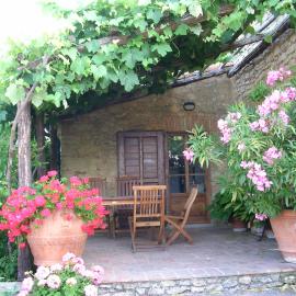 PERGOLA at Le Pietraie a cottage with many flowers