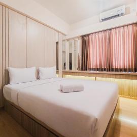 Spacious and Homey 2BR at Sky House BSD Apartment By Travelio