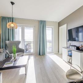 5 Sterne Ferienwohnung Stranddomizil mit Eckbalkon und Boddenblick, hôtel à Wustrow