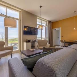 Wellenreiter - 5-Sterne Ferienwohnung mit Südbalkon und Boddenblick