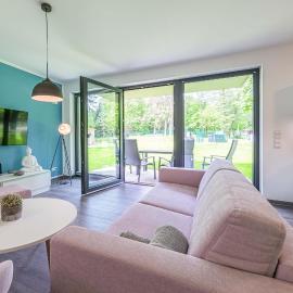 Maulwurfsgarten - Modernes Apartment mit Terrasse, Walk-In-Dusche & Wellnesszugang