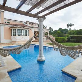 Noble beach villa with private garden and pool