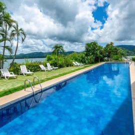 Elegant Condo with Brand-New Fixtures, Shaded Tropical Terrace, and Secluded Beach Access