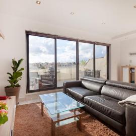 Penthouse and BBQ Kitchen Island & Massive living by 360 Estates