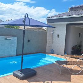 Mar Doce Lar Casa na praia de guaratuba com piscina e ar condicionado
