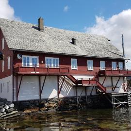 Charming sea house with sauna and private jetty, hotel in Ølve
