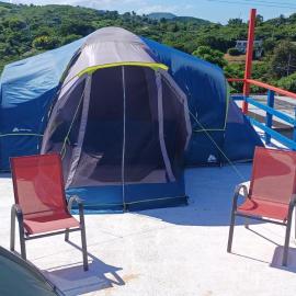 Rooster Run Camping is a - rooftop & elevated camping experience! Incredible views of The Rain Forrest and Culebra across the Atlantic Ocean - Tents, towels, comfortable Air Beds, Warm Shower-Central Location- 5 beaches -25 min walk & Ferry is 20 min – hotel w mieście Vieques