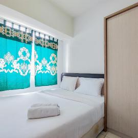 Cozy Living and Tidy 2BR Serpong Greenview Apartment By Travelio