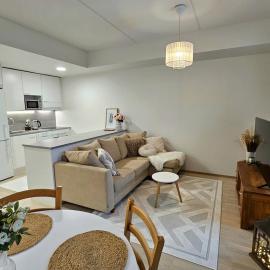Stylish top floor ap, with private parking, next to a tram stop