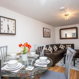 Central 2BR Apartment - 4 Min Walk To Train, High-Speed WiFi & Smart TVs!