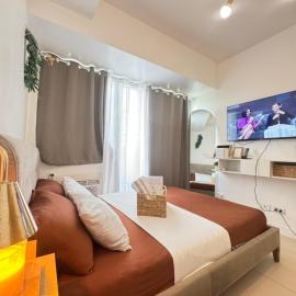The Residences at Commonwealth Quezon City by Snazzy Staycation, hotel u Malini