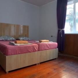 large bedroom with two separate beds