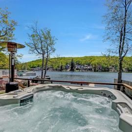 Lakefront home with kayaks fire pit hot tub and walk to restaurants and bars