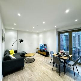 Stylish 2BR Apartment with Balcony & Views