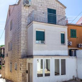 Stone house with two balconies and the sea view