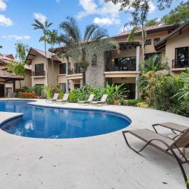 Modern Island-Themed Condo with Floor-to-Ceiling Windows & Garden and Pool Views Within Walking Distance of the Beach