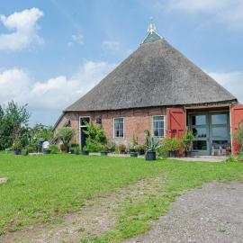 Farmhouse by Lauwers River with Rowing Boat
