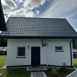 Dom wypoczynkowy Leśny Zakątek 2 nad jeziorem, hotel en Wartkowo