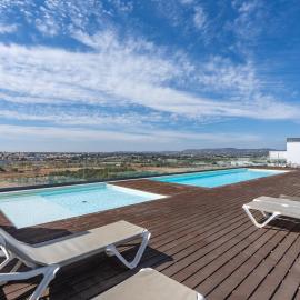 Rooftop Pools & Balcony Haven by HostWise