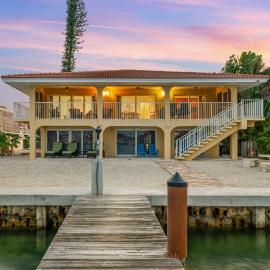 Sunset Harbor Waterfront Villa with Dock Cabana Club