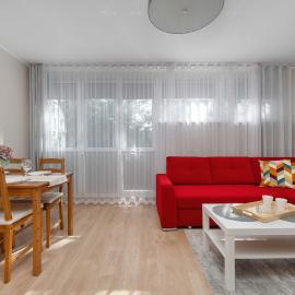 Red Apartment in Wrocław with Two Bedrooms and Desk for Remote Work by Noclegi Renters