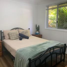 Stylish Chic King Bedroom with shared bathroom