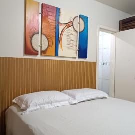 Apartamento térreo com ar condicionado e 2 suítes bem localizado