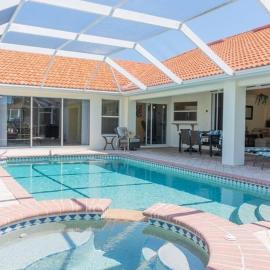 Sunshine paradise retreat with heated pool and canal access