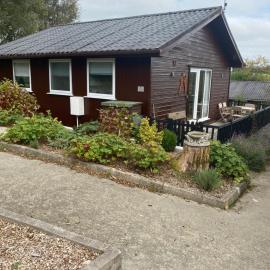 Cosy north Devon lodge within Hartland forest, hotel em Woolfardisworthy