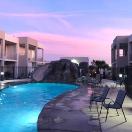 New 4 bed 3 and half bath with pool, hot tub, waterslide and PS5
