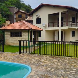 Single-story house with pool and barbecue area