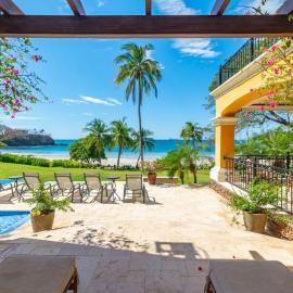Elegant Mediterranean-Style Mansion with Beachfront Views and Private Infinity Pool