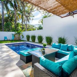 Ultramodern Townhome with an Inviting Coastal Design and Lush Outdoor Oasis with a Private Pool