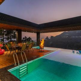 StayVista at The Kasa with Rooftop Infinity Pool and Home Theatre