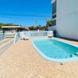 Casa com piscina próximo a praia, hotel in Rio Grande