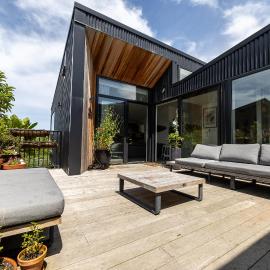 Elevated architectural home with stunning sea views