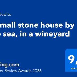 A small stone house by the sea, in a wineyard