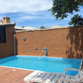 Casa de praia veraneio com piscina e área de jogos