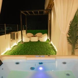 Zythum Jacuzzi Roof Top Movie Room by Homeyhuts