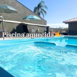 Casa Sol da Manhã - Piscina aquecida com hidromassagem - 300m da praia, hotel in Guaratuba