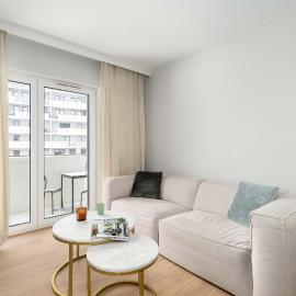 Beige and Green Two Bedroom Apartment in Poznań with Parking and Bathtub by Noclegi Renters