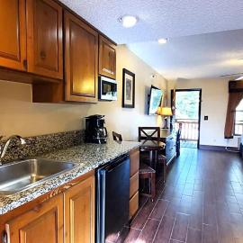 Deluxe Suite with Kitchenette and Balcony, Steps to Rodeo and Pool! 253