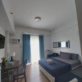 Family Suites at the Amani Grand Residences - Mactan Airport, hotel di Pusok