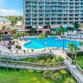 Dog-friendly lakefront condo w/WiFi, W/D, AC, resort amenities, near attractions