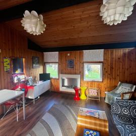 Lush 1970s Scandi-inspired Welsh woodland cabin