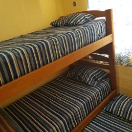 Small room with bunk bed, bathroom, AC and WiFi