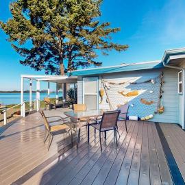 Waterfront home with panoramic bay views deck fireplace & beach access